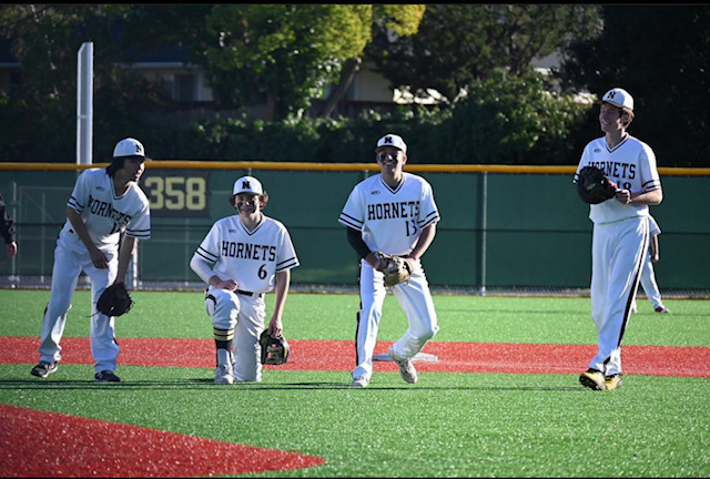 Novato infielders gathering around the pitchers mound